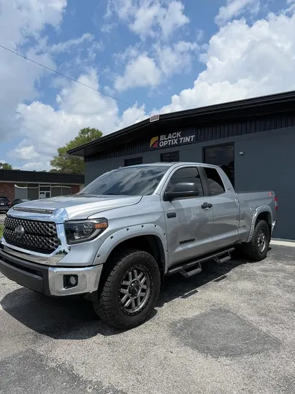 Silver Toyota Tundra with full ceramic tint